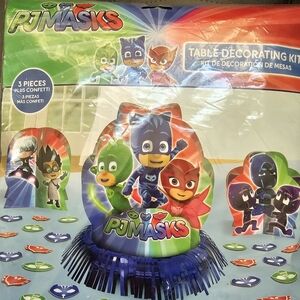 PJ Masks party banner, table decor, and party favors.